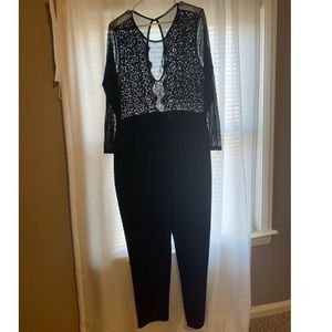 Black Jumpsuit with top sheer detail.